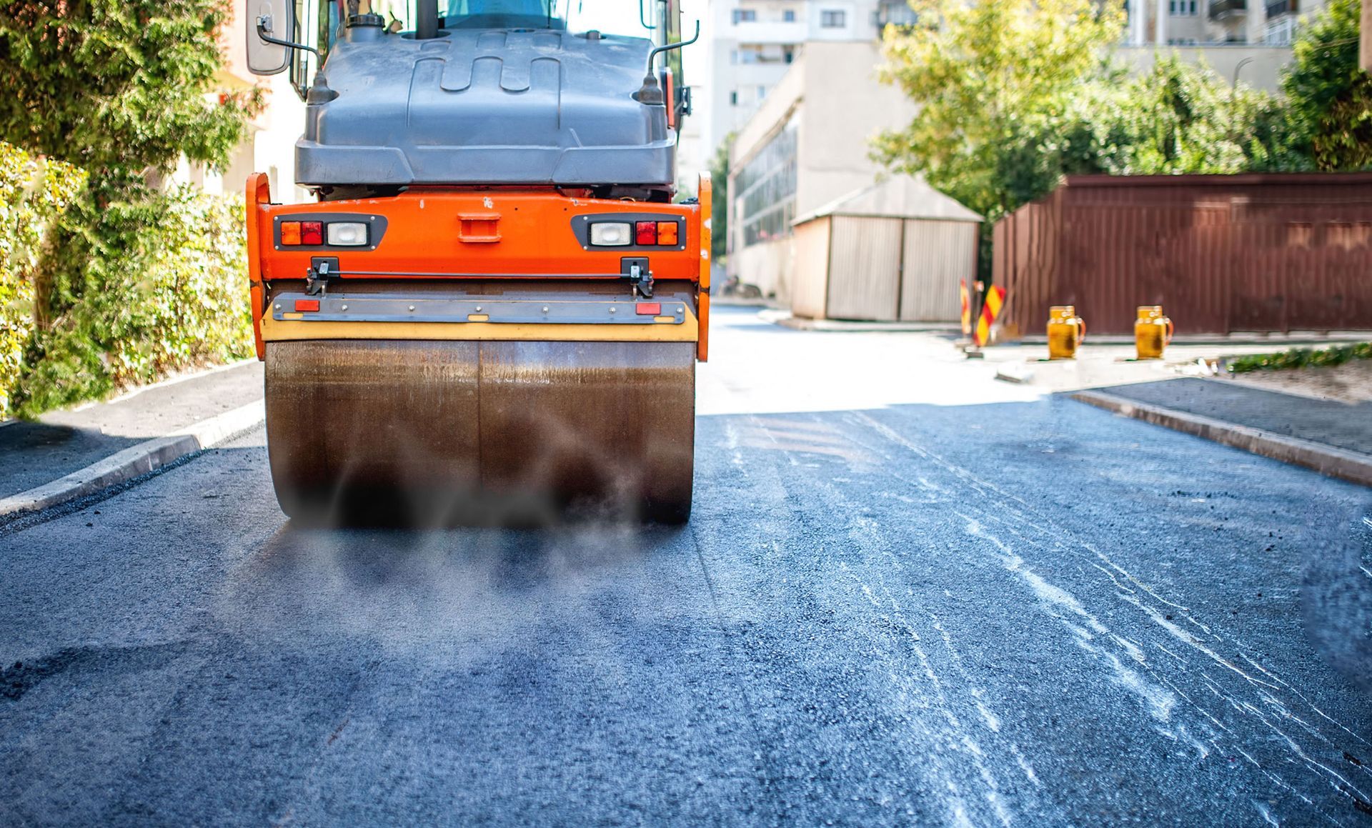 Public Paving crew preparing a fresh asphalt surface